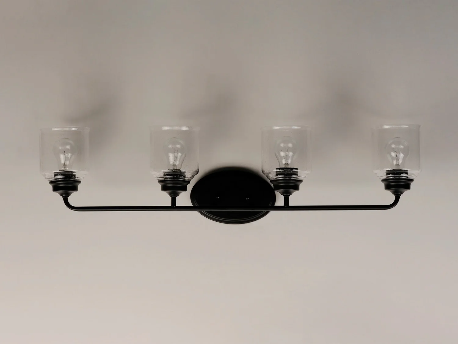 Acadia 4-Light Bathroom Vanity Light with Clear Seedy Glass Shade, Black - Image 4
